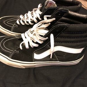 Black and white high top vans